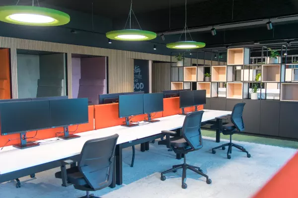 Pami sit-stand desks with ergonomic office chairs and acoustic partition wall